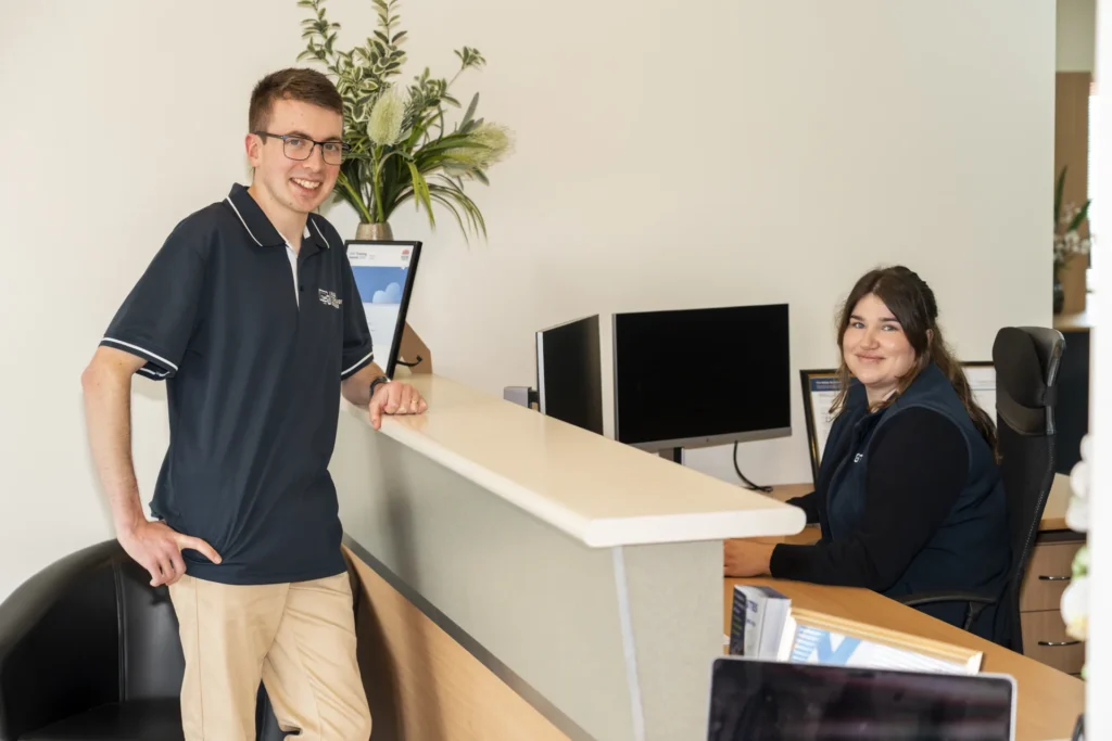 Alex working at his desk, Wagga Technology Solutions